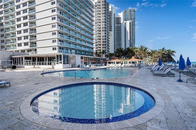 view of swimming pool featuring a patio area