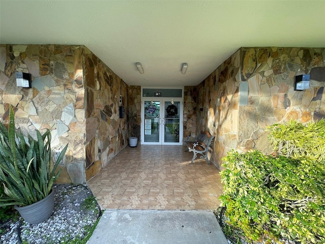 view of exterior entry featuring french doors