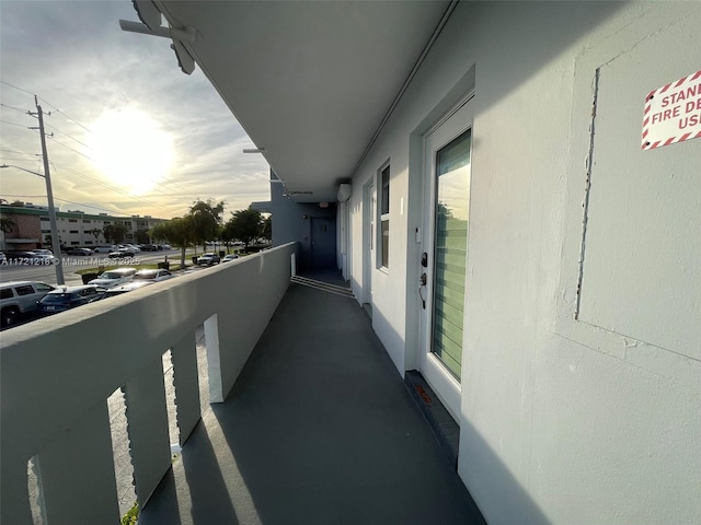 view of balcony at dusk