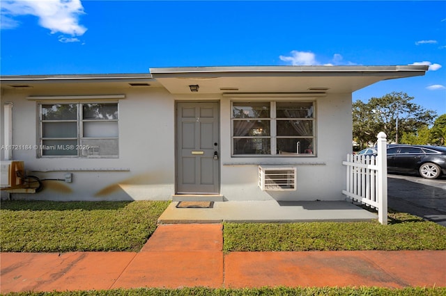 doorway to property with ac unit