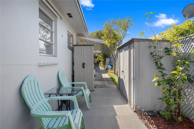 view of patio / terrace featuring a storage shed