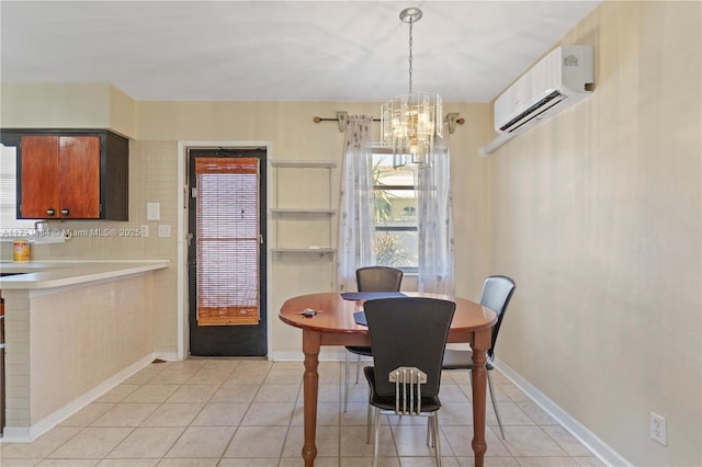 tiled dining area with an inviting chandelier and a wall mounted AC