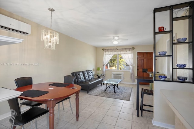 dining space with ceiling fan with notable chandelier, an AC wall unit, and light tile patterned floors