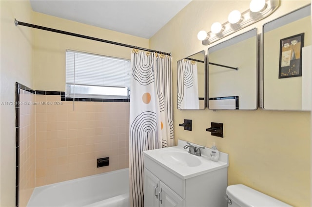 full bathroom featuring vanity, toilet, and shower / bathtub combination with curtain