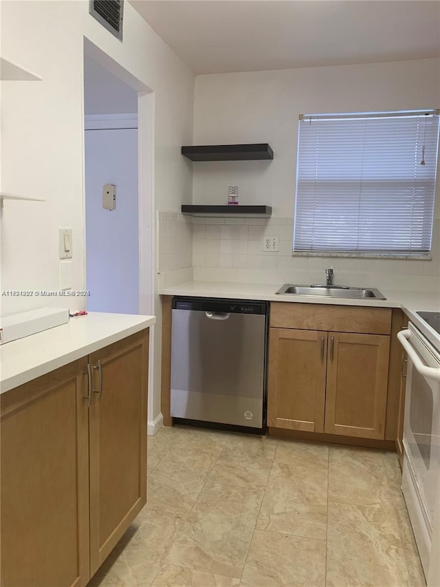 kitchen with stainless steel dishwasher, backsplash, range, and sink