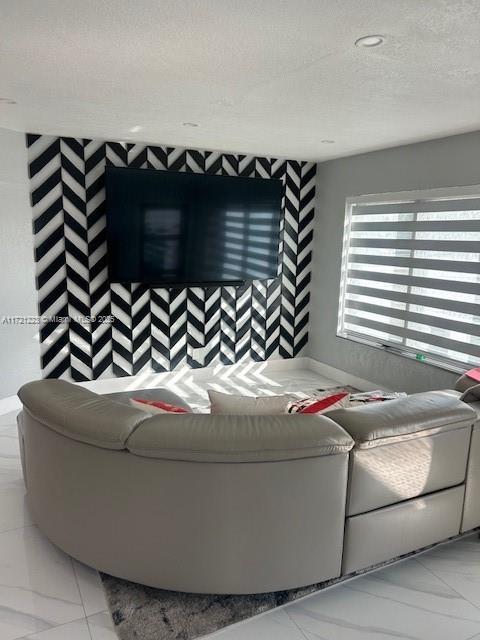 living room featuring a textured ceiling