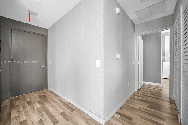 corridor featuring hardwood / wood-style floors