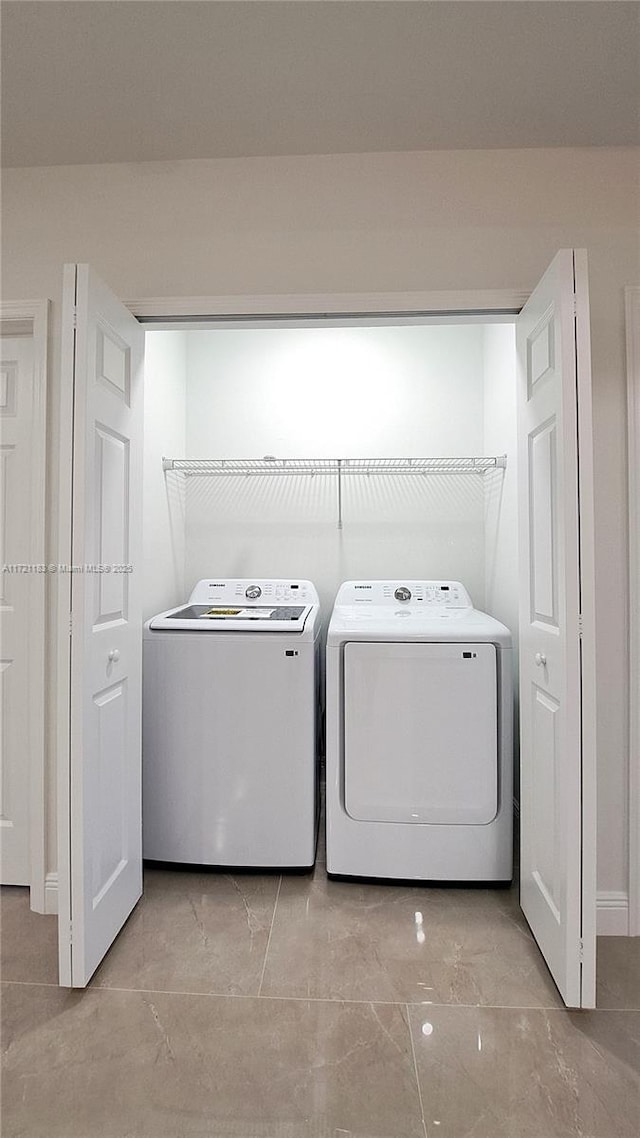 laundry room featuring independent washer and dryer