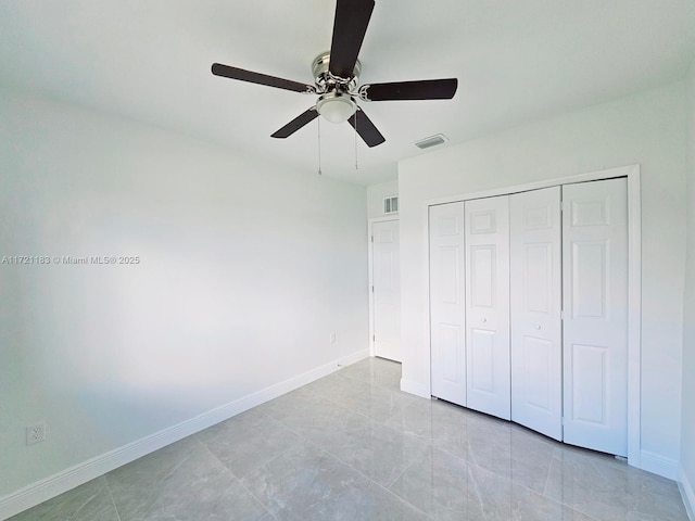 unfurnished bedroom featuring a closet and ceiling fan