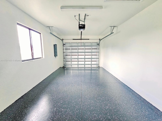 garage with electric panel and a garage door opener