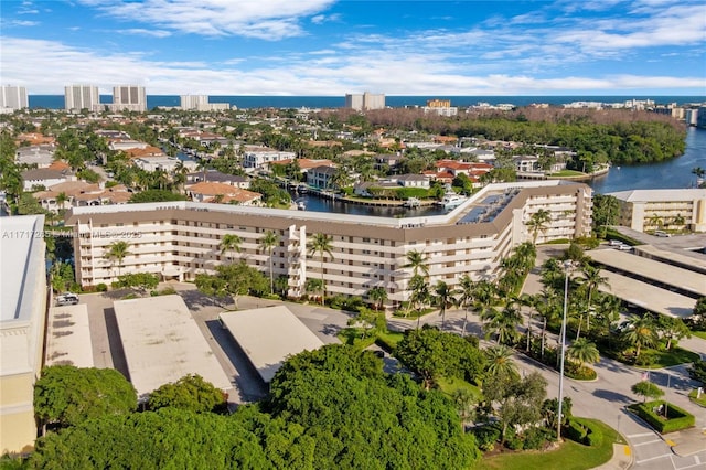 drone / aerial view with a city view and a water view