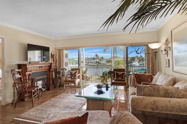 living room featuring tile patterned flooring, a textured ceiling, and ornamental molding