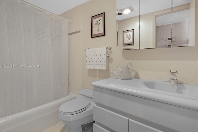 full bathroom featuring shower / bath combination with curtain, toilet, vanity, and tile patterned flooring