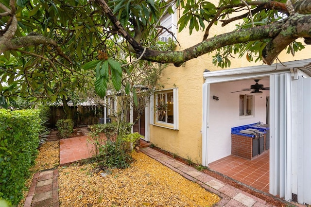 exterior space featuring a patio area and ceiling fan