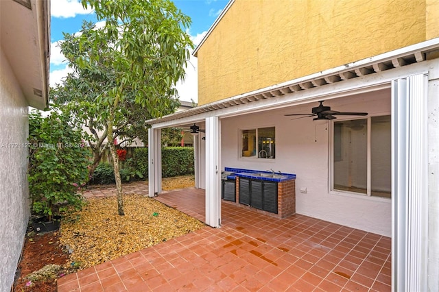 view of patio featuring ceiling fan