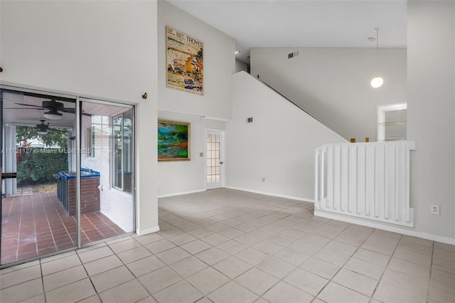 interior space featuring ceiling fan and high vaulted ceiling