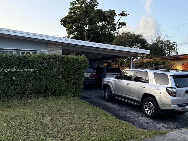 view of parking featuring a yard