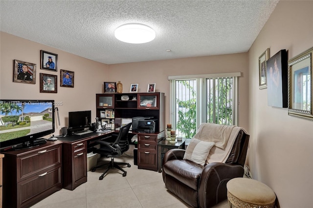 tiled home office with a textured ceiling