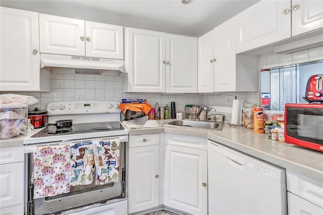 kitchen featuring backsplash, white cabinetry, sink, and white appliances