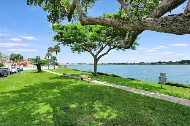 exterior space with a yard and a water view