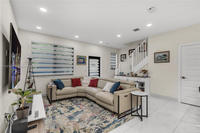 living room featuring marble finish floor, recessed lighting, visible vents, baseboards, and stairs