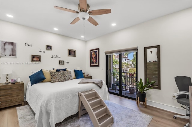 bedroom with access to exterior, baseboards, wood finished floors, and recessed lighting