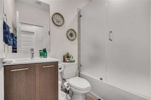 bathroom featuring toilet, washtub / shower combination, visible vents, and vanity