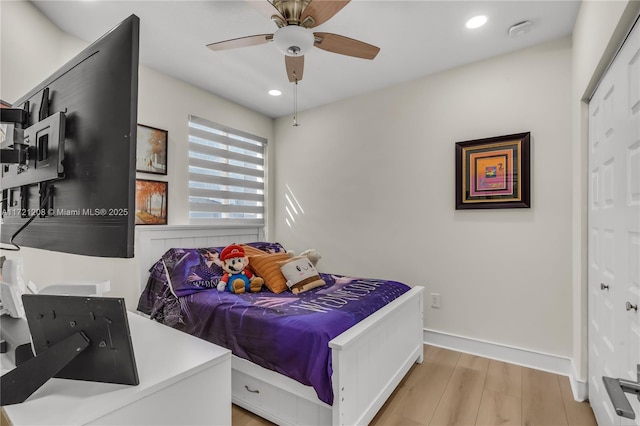 bedroom featuring baseboards, ceiling fan, light wood finished floors, and recessed lighting