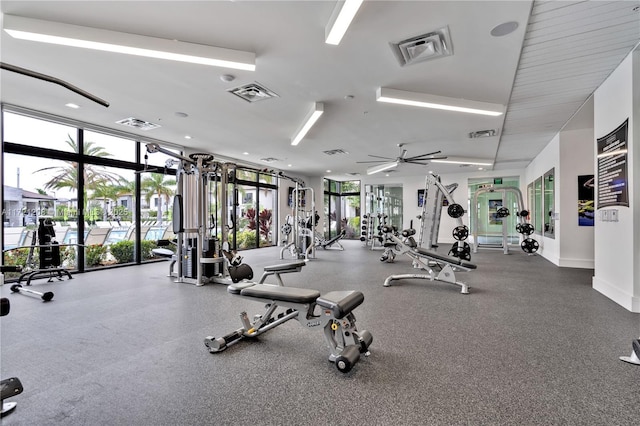 workout area featuring expansive windows and visible vents