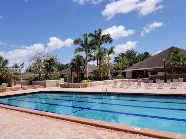 view of swimming pool featuring a patio