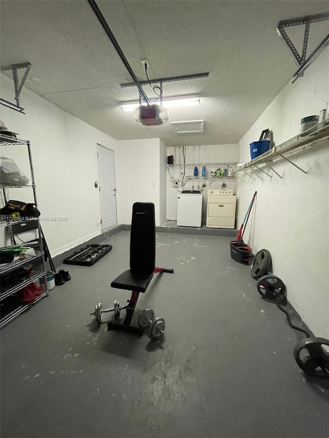 garage featuring separate washer and dryer and a garage door opener