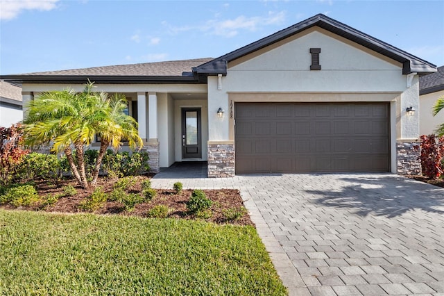 view of front facade featuring a front yard and a garage