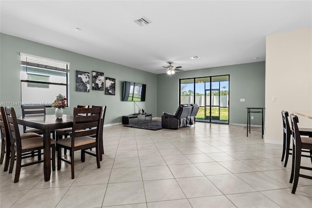 dining room with light tile patterned floors and ceiling fan