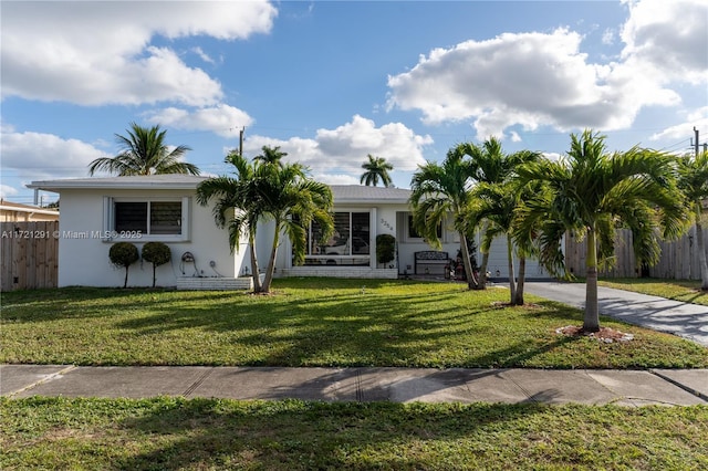 ranch-style house with a front lawn and a garage