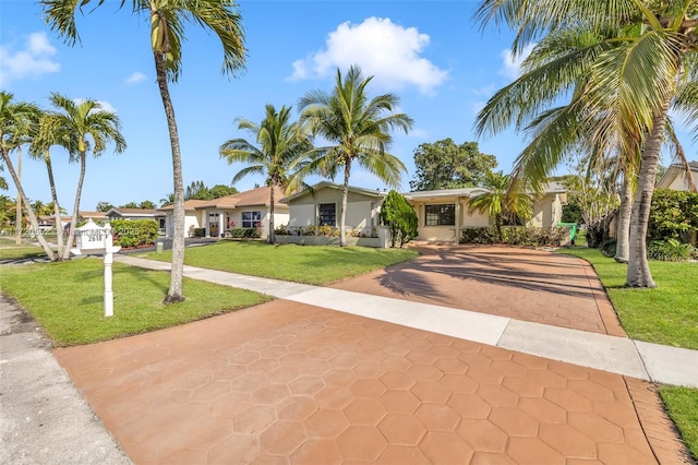 ranch-style home featuring a front yard