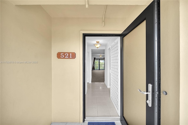 corridor with light tile patterned floors