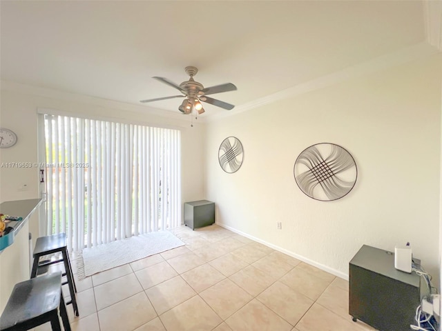 empty room with light tile patterned floors, ceiling fan, crown molding, and a healthy amount of sunlight