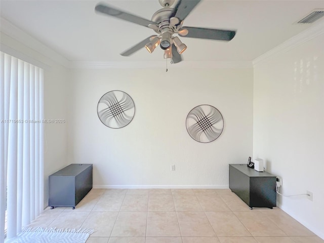 tiled empty room featuring ceiling fan and crown molding