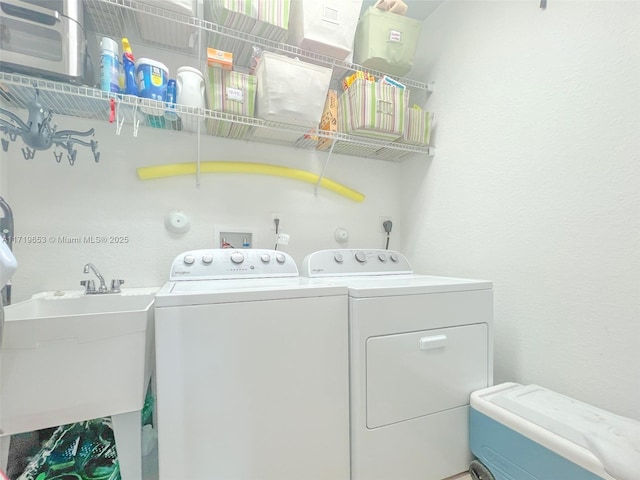 laundry room featuring sink and independent washer and dryer