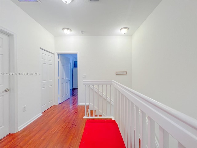 hallway featuring wood-type flooring