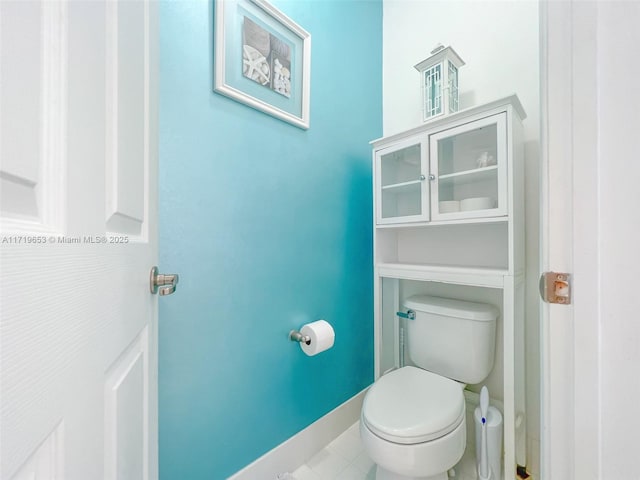 bathroom featuring tile patterned flooring and toilet