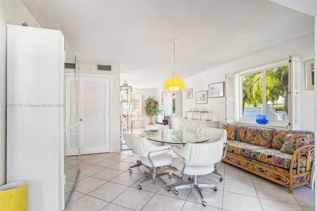 dining area with light tile patterned flooring