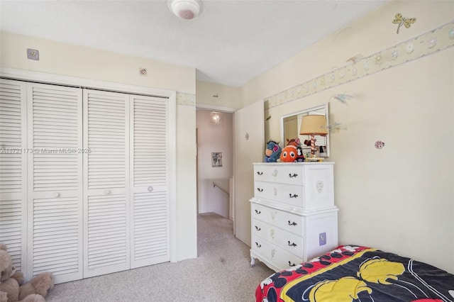 carpeted bedroom featuring a closet