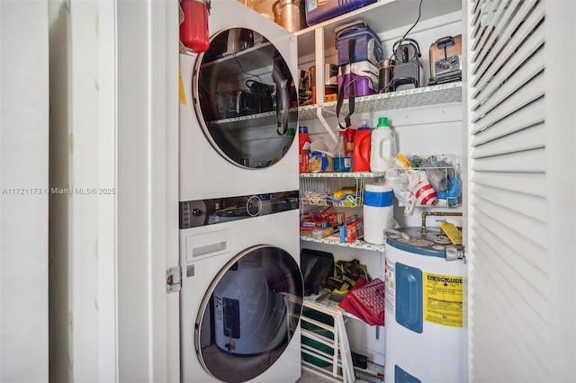 laundry area featuring electric water heater and stacked washer / dryer