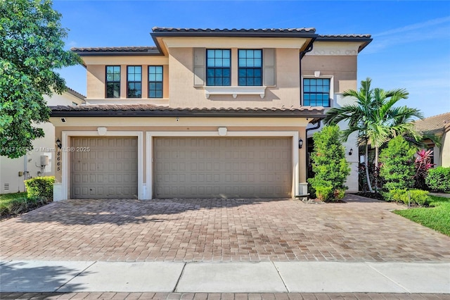 mediterranean / spanish-style house featuring a garage