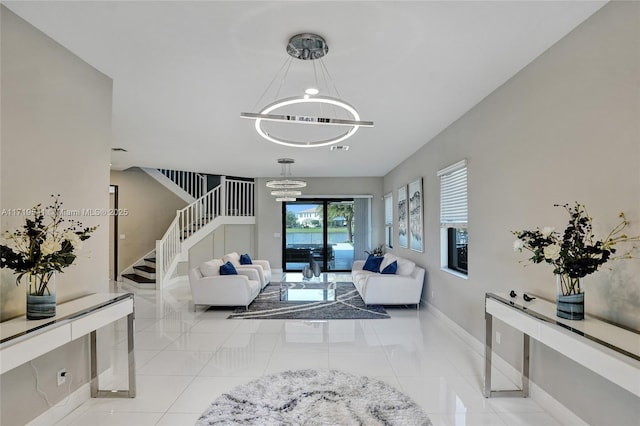 living room with light tile patterned flooring and a chandelier