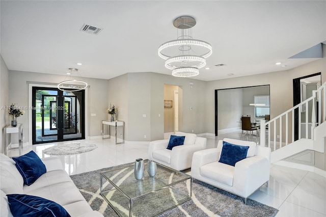 living room featuring light tile patterned floors and an inviting chandelier