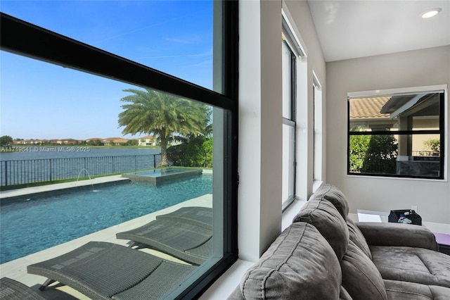 interior space featuring pool water feature and a water view