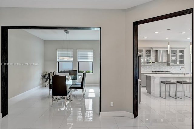 tiled dining area with sink