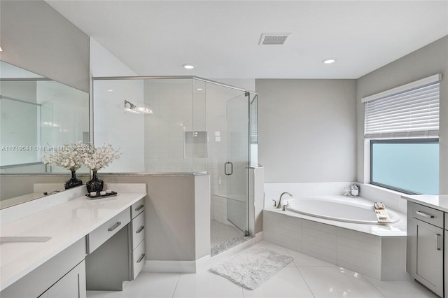 bathroom with tile patterned floors, vanity, and plus walk in shower